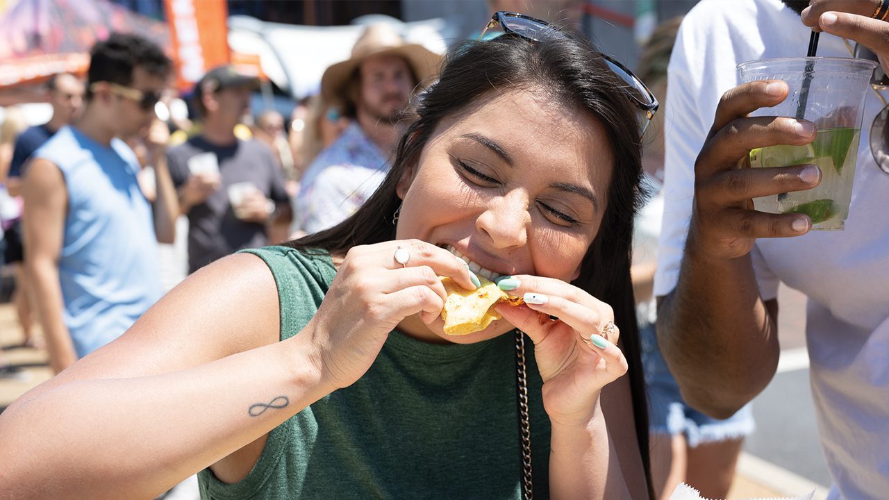FESTIVALS_TacoFest_WomanEating_1280x720