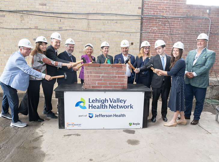 ArtsQuest Celebrates Brick Breaking at Turn & Grind Shop